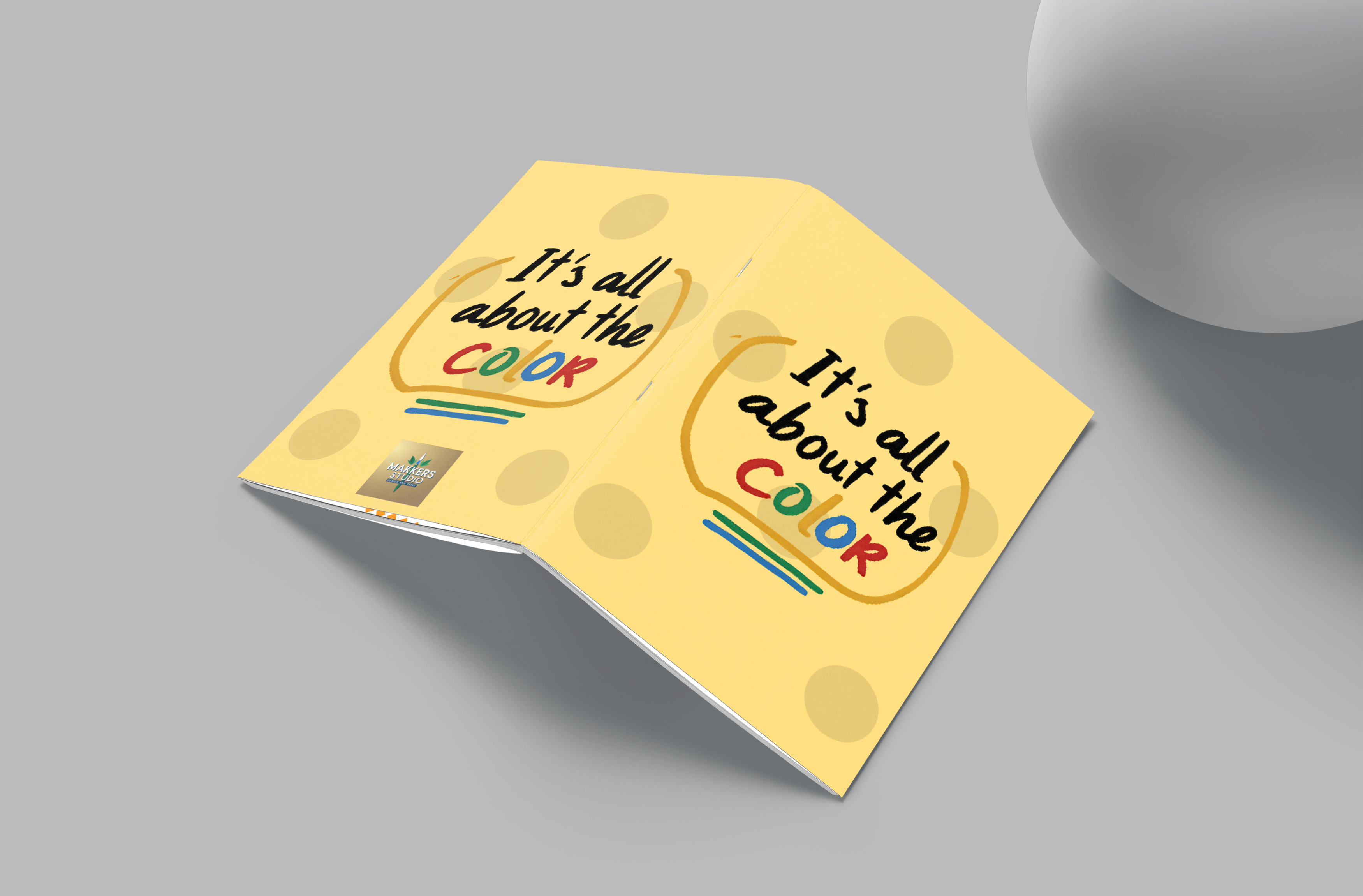Yellow book titled 'It's all about the color' on a gray background