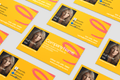 Yellow business cards with a logo and contact information on a white background