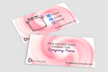 Two pink business cards with contact information on a gray background