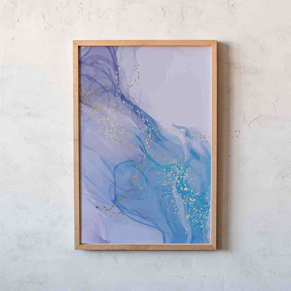 Framed abstract wall art hanging on a textured off-white wall. The artwork features flowing marbled patterns in shades of blue, lavender, and light purple with scattered gold foil accents, enclosed in a light natural wood frame.