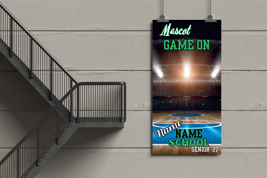 Basketball court banner with 'Mascot Game On' text on a wall next to a staircase.