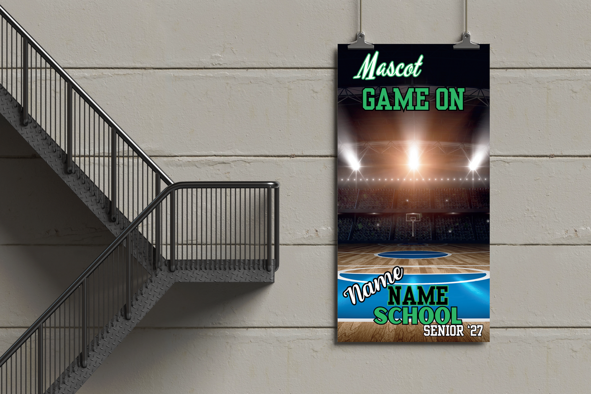 Basketball court banner with 'Mascot Game On' text on a wall next to a staircase.