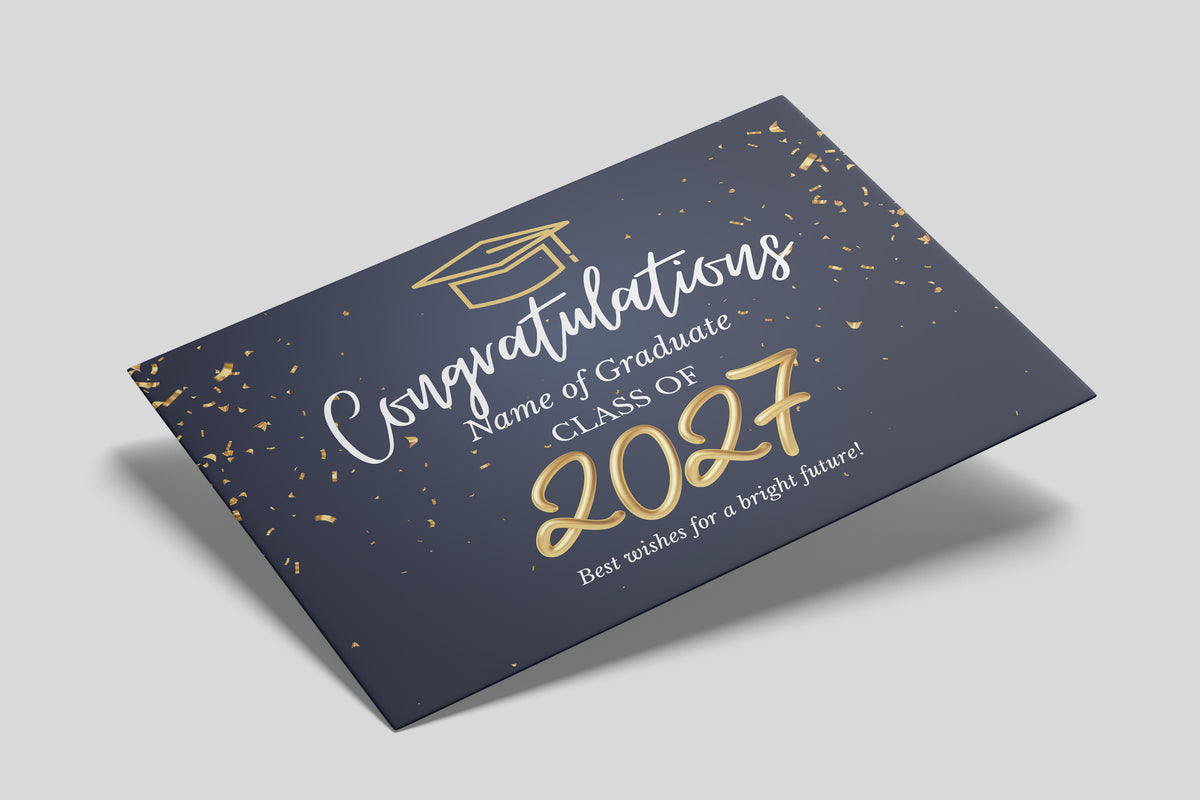 A rectangular graduation certificate card shown at an angle on a light gray background. The card is dark navy blue with scattered gold confetti and gold and white text reading 'Congratulations Name of Graduate CLASS OF 2027 Best wishes for a bright future!' A small graduation cap icon appears near the top.