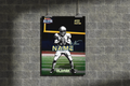 Football player poster on a brick wall