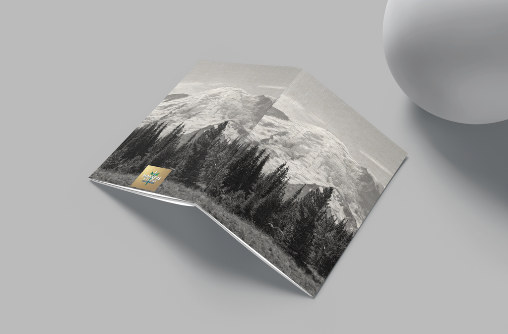 Product packaging with mountain design on a gray surface