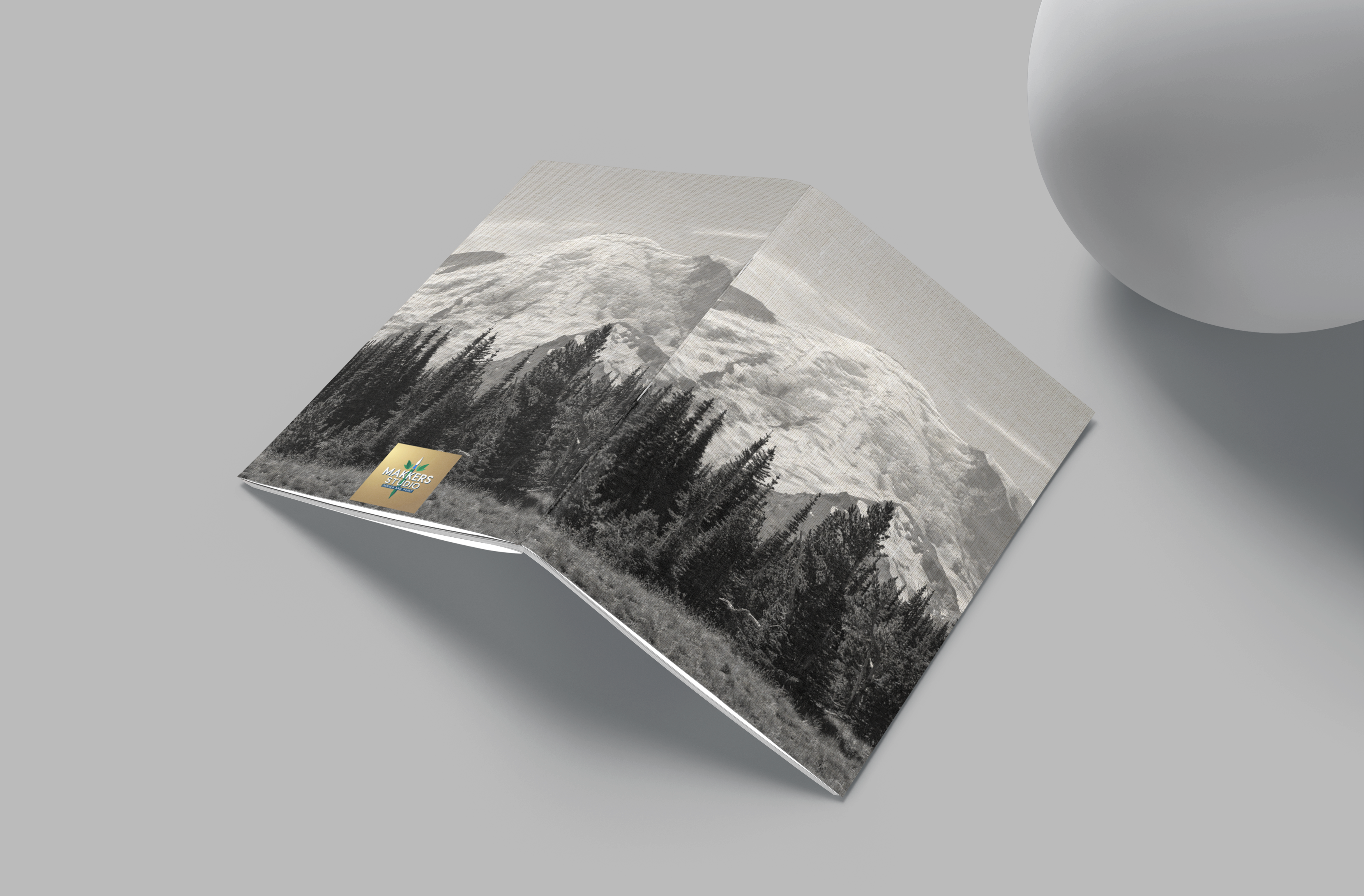 Product packaging with mountain design on a gray surface