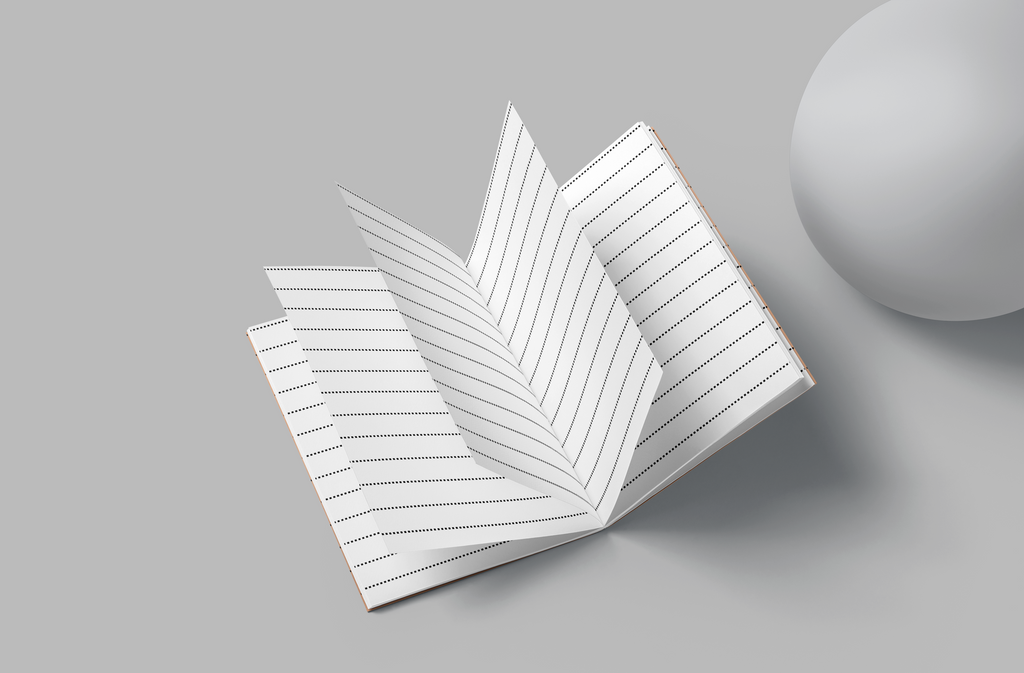 Open notebook with lined pages on a gray background