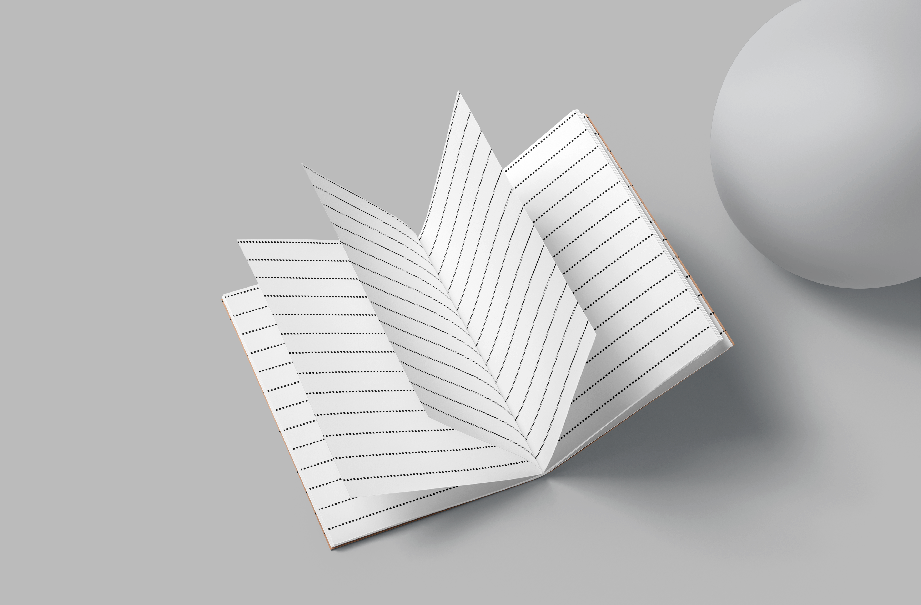 Open notebook with lined pages on a gray background