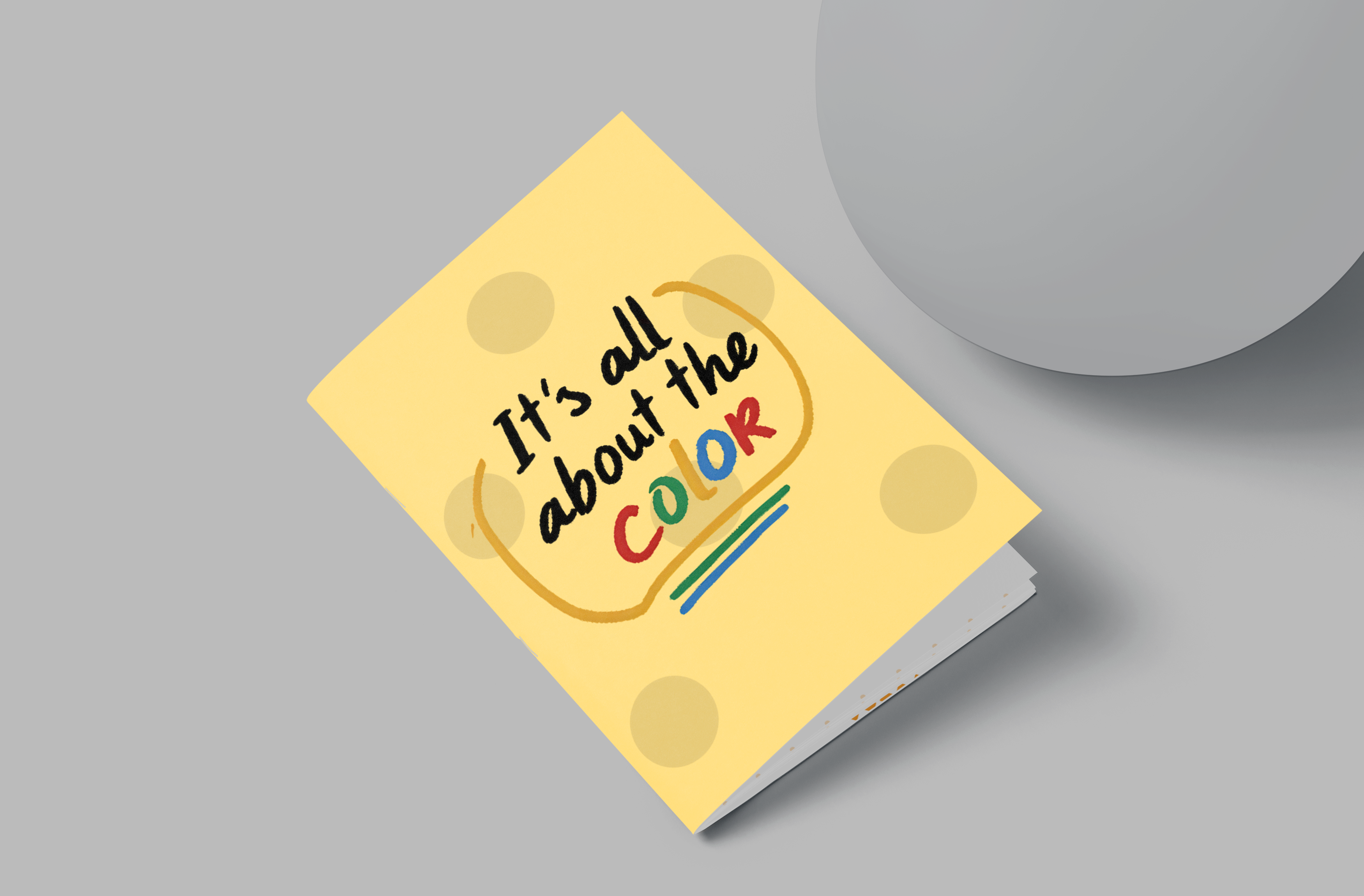 Notebook with 'It's all about the color' text on a gray background