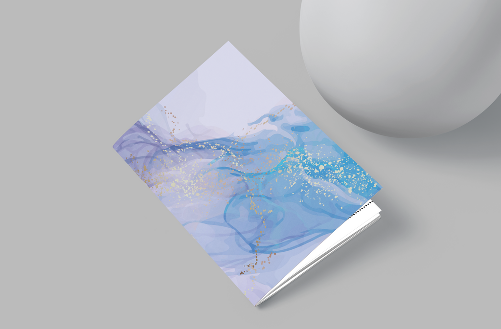 Notebook with blue abstract design on a gray background