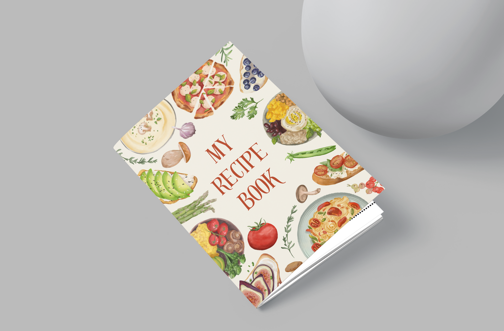 Cookbook with colorful food illustrations on a gray background