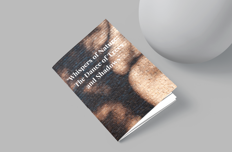 Book titled 'Whispers of Nature: The Dance of Light and Shadows' on a gray background